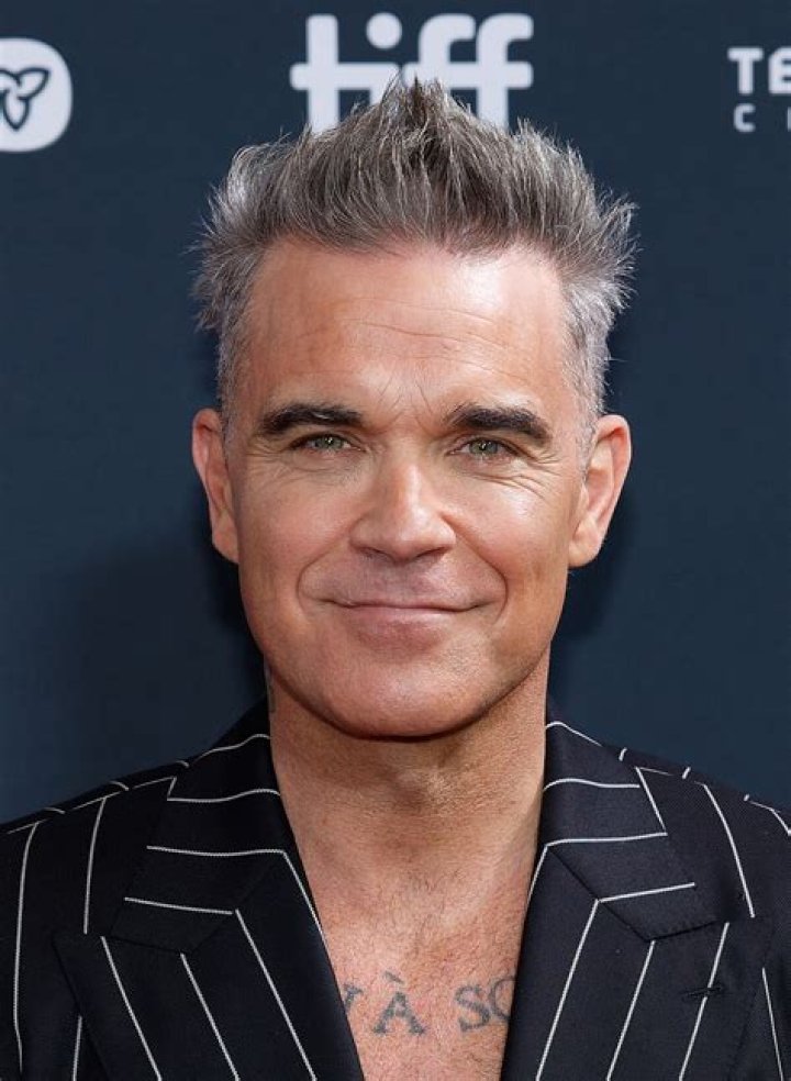 How old is robbie williams?