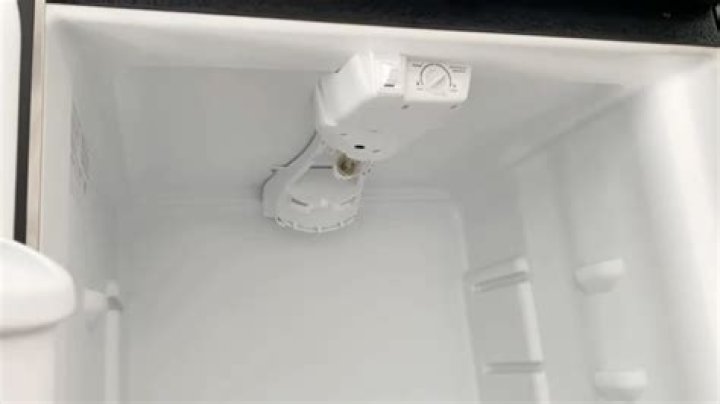 Where is the defrost drain on a frigidaire refrigerator?