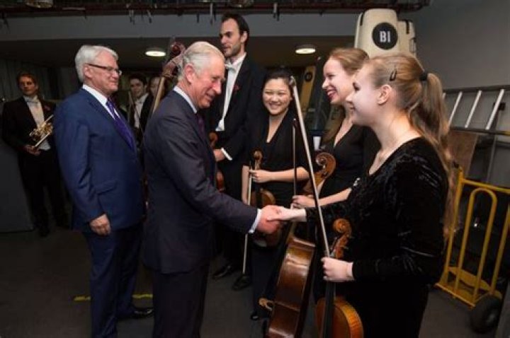 Why do cellists shake their hands?